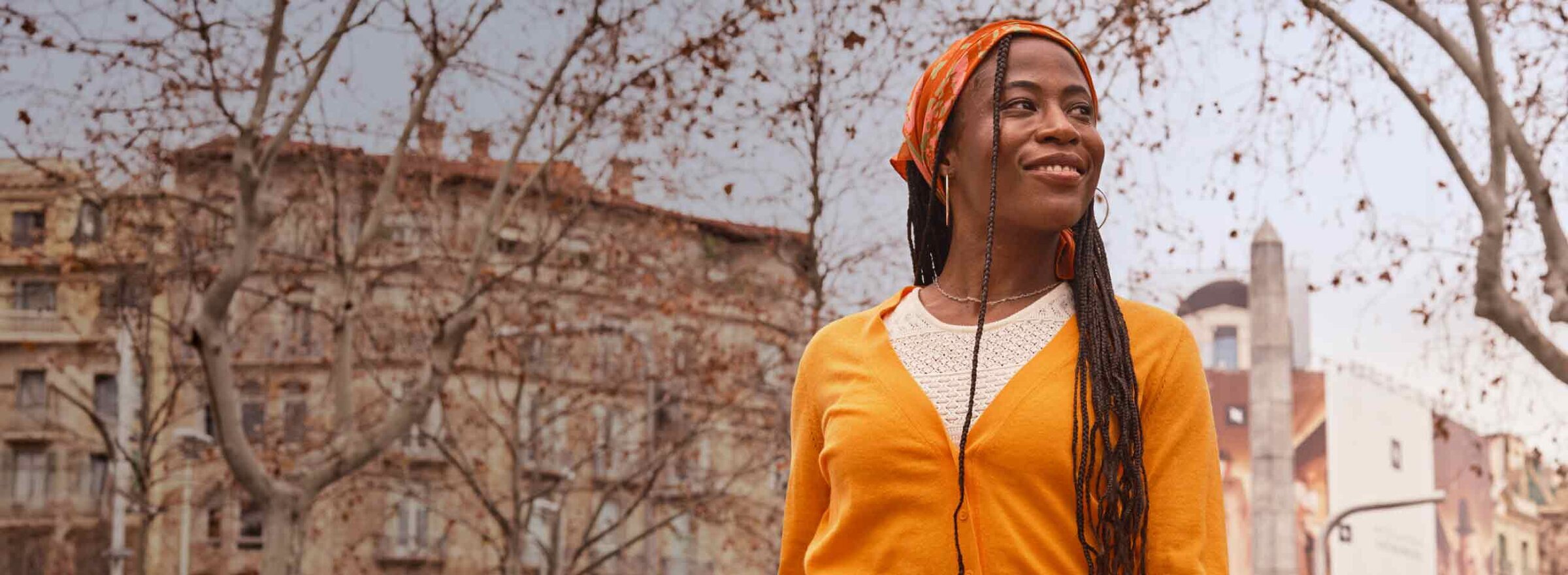 Woman smiling outside.